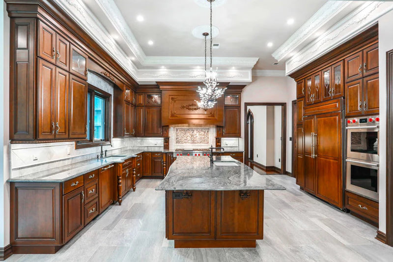 Contemporary open concept kitchen with sleek flat-panel cabinets and modern appliances - Captivating Cabinets