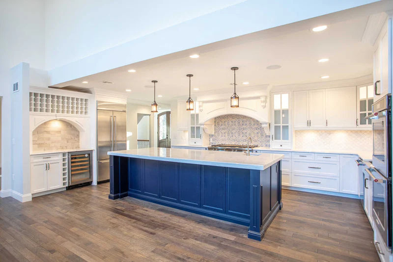 Custom kitchen design with premium cabinetry, waterfall edge counters, and integrated storage solutions - Captivating Cabinets