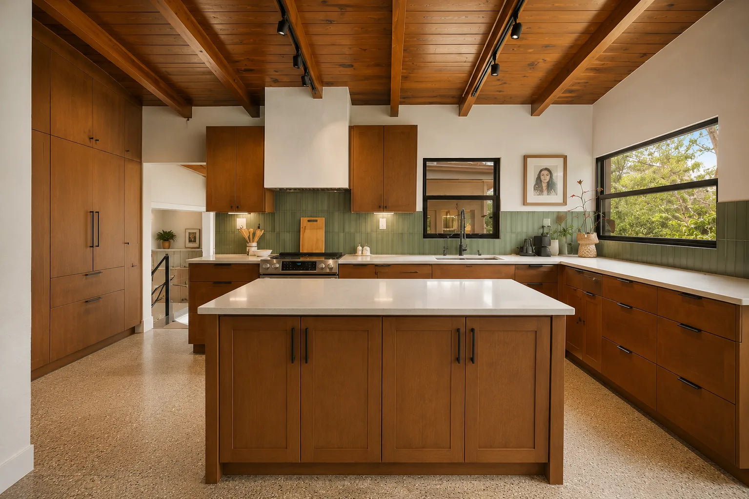 Bright kitchen with glass-front upper cabinets and brass hardware